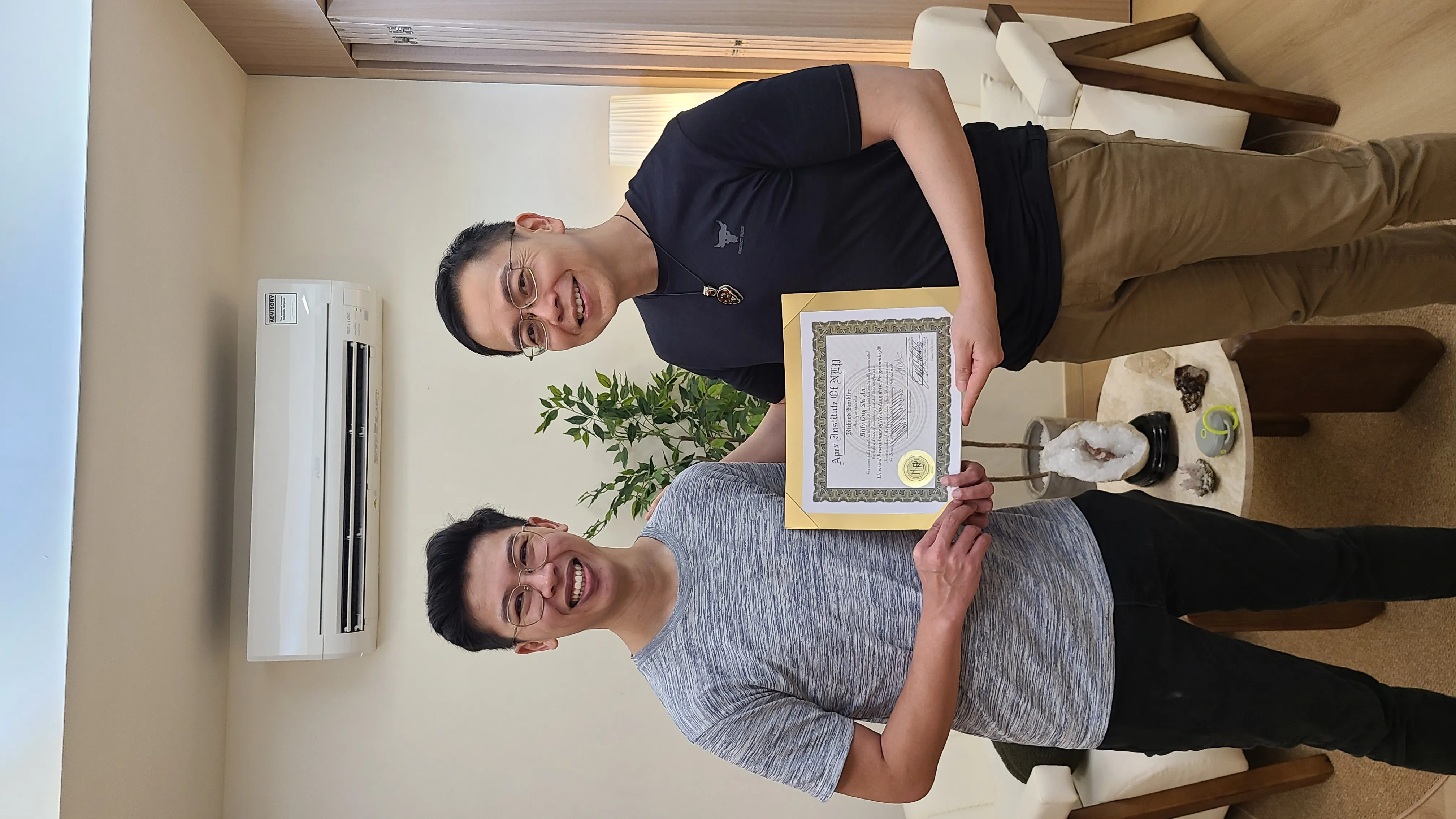 Billy Ong receiving his Licensed Practitioner of Neuro-Linguistic Programming certificate with Stuart Tan